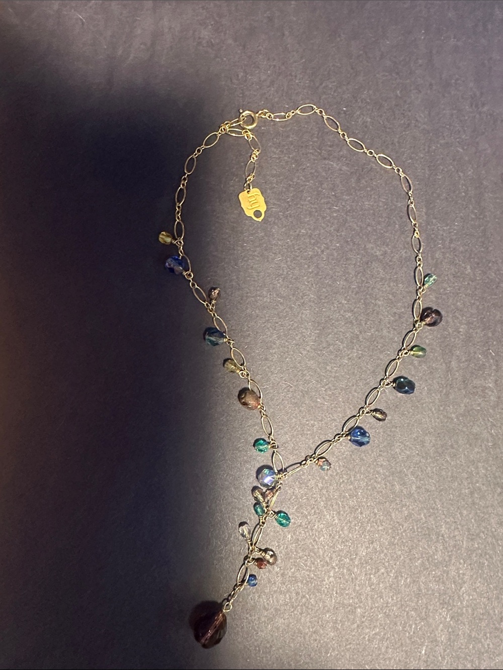 Holly Yashi  gold colored vintage Necklce“.